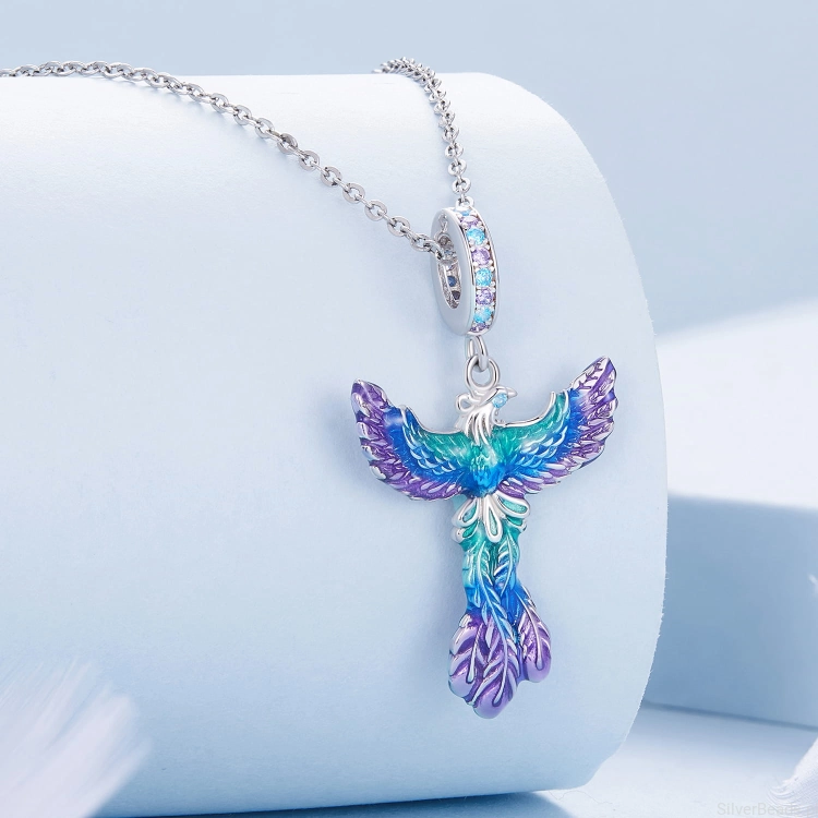 Srebrna zawieszka charms Fenix ozdobiony emalia i kryształkami pasująca do łańcuszka srebrnego naszyjnika