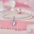 Srebrna modułowa bransoletka typu Pandora i charms Topniejące serce otaczające różowy kryształ