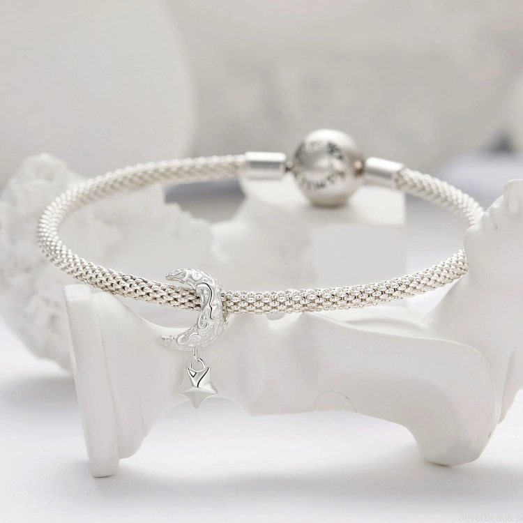 Srebrna modułowa bransoletka typu Pandora i charms Księżyc z gwiazdką ozdobione ornamentem