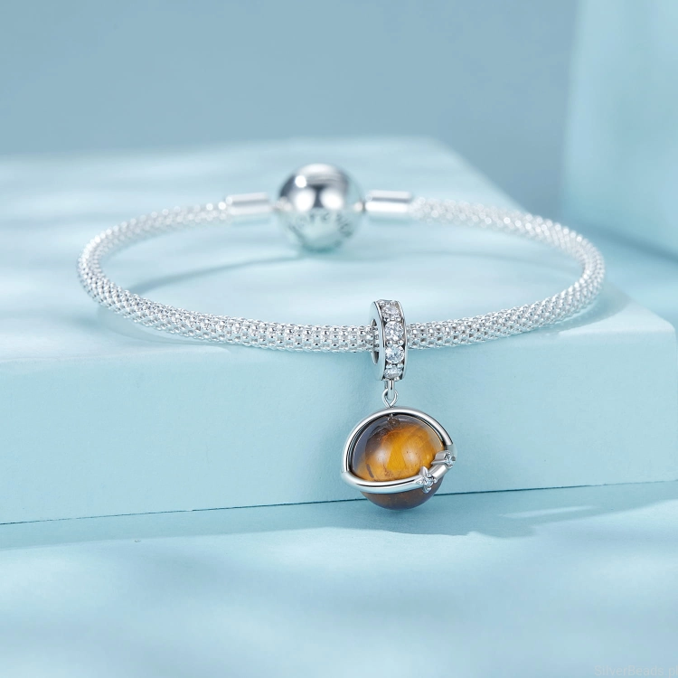 srebrny charms planeta z kamieniem tygrysie oko
