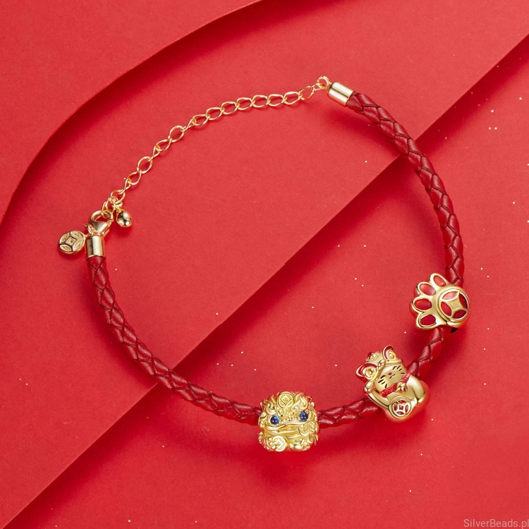 zestaw srebrnych charmsów pozłacanych amulety.jpg