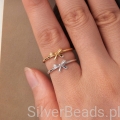 Modny pierścionek z drobną kokardką – delikatny błysk i styl