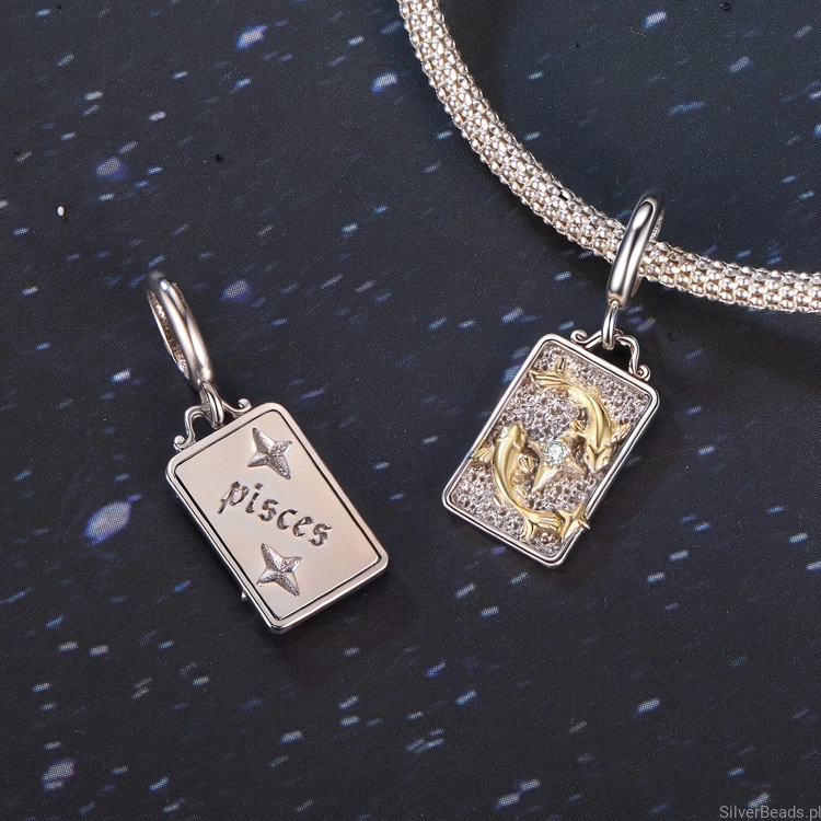 Zodiakalne Ryby – srebrna zawieszka z pozłacanymi rybami.