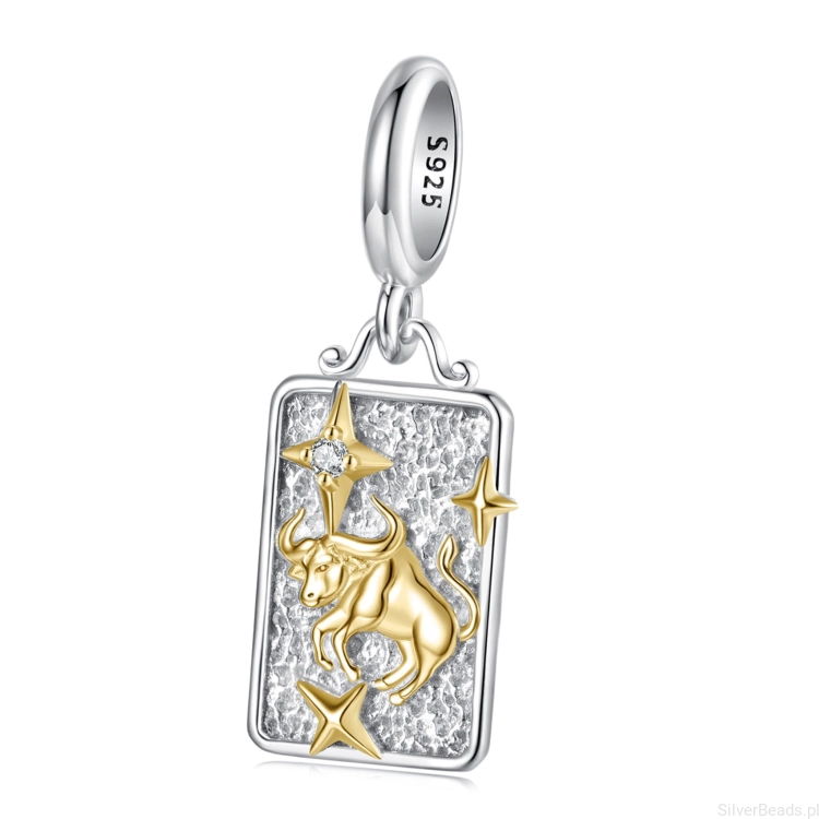 Srebrny charms byk ze złotym symbolem zodiaku.