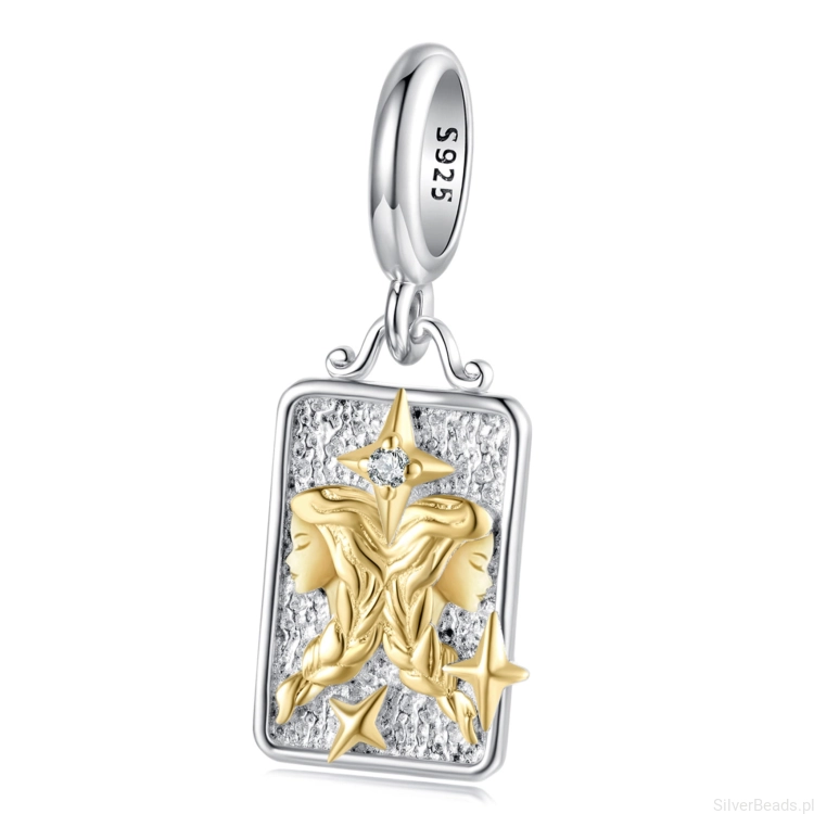 Srebrny charms bliźnięta ze złotym symbolem zodiaku.